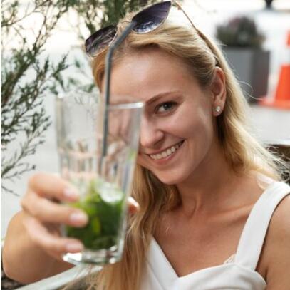 Ava smiling with a drink